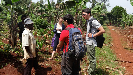 Northwestern students talking with villagers